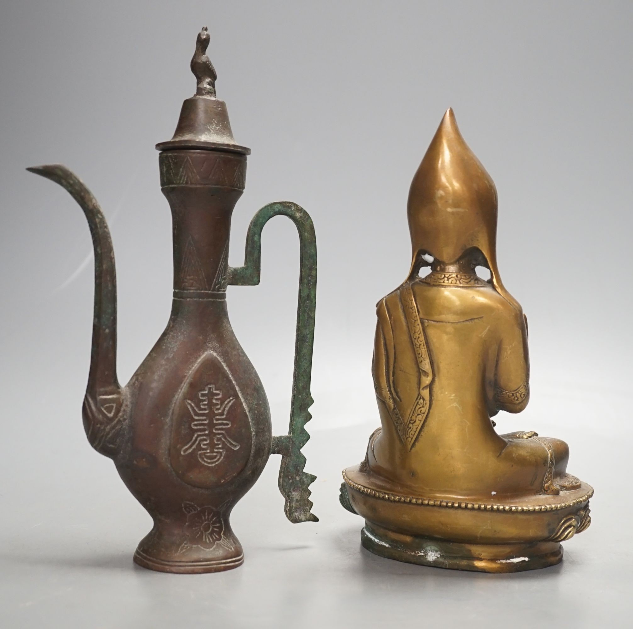 A Chinese bronze vessel and a bronze figure of a Dalai Lama, vessel 24 cms high.